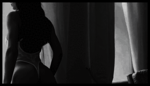 An Asian masseuse in a serene spa setting, performing a massage with grace and precision.